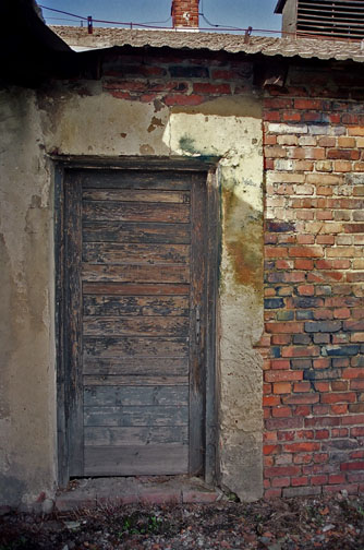 Blue stains near door of disinfection building. Birkenau