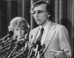 Secretary of Health and Human Services Margaret Heckler eyes Robert Gallo at the 1984 news conference where she announced his discovery of the cause of AIDS.
