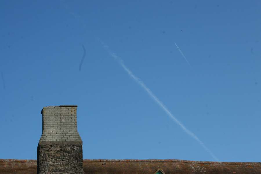 Same plane with contrail, and chemtrail below.