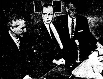 Otis T. Carr (Center)