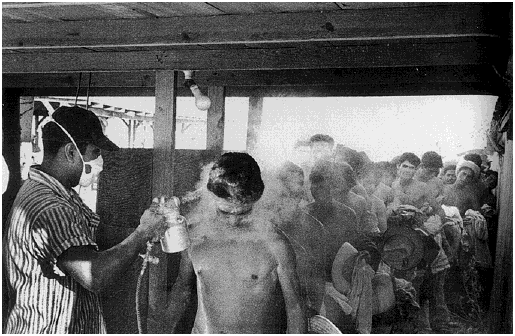 Leonard Nadel's photograph from 1956 of Central Valley farmworkers forced to stand naked in line to be sprayed with pure DDT.